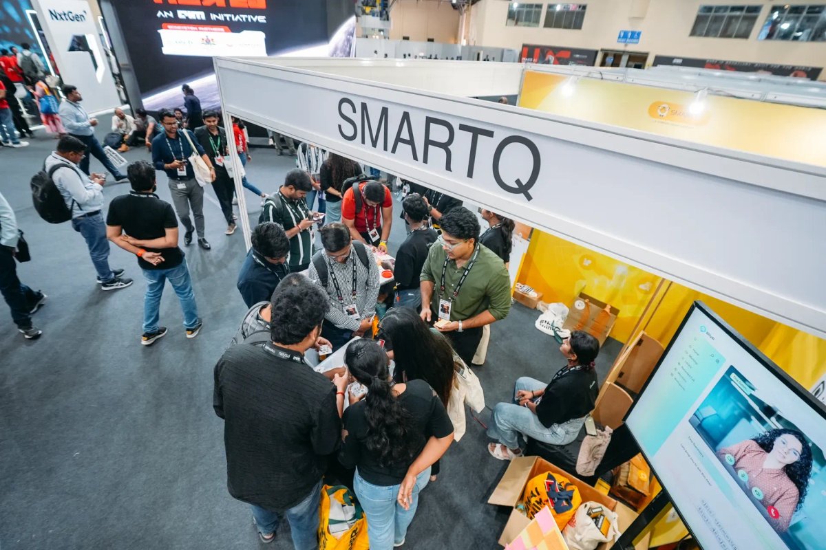 Attendees engaging at the SmartQ booth
